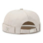 X Emblem Adjustable Brimless Skullcap